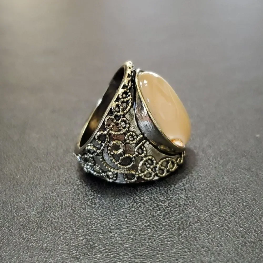 Gold tone ring with stone